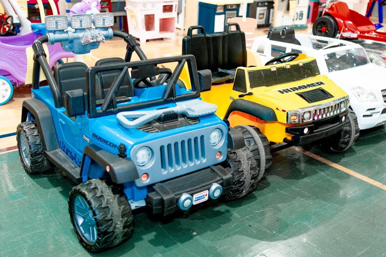 Battery powered ride on toys on the sales floor at the Reading JBF sale.