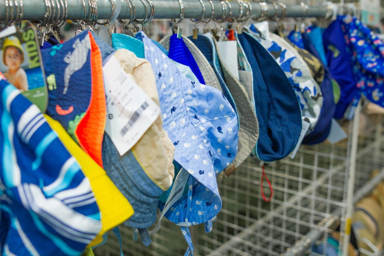 Toddler and Baby Sun Hats hanging up.