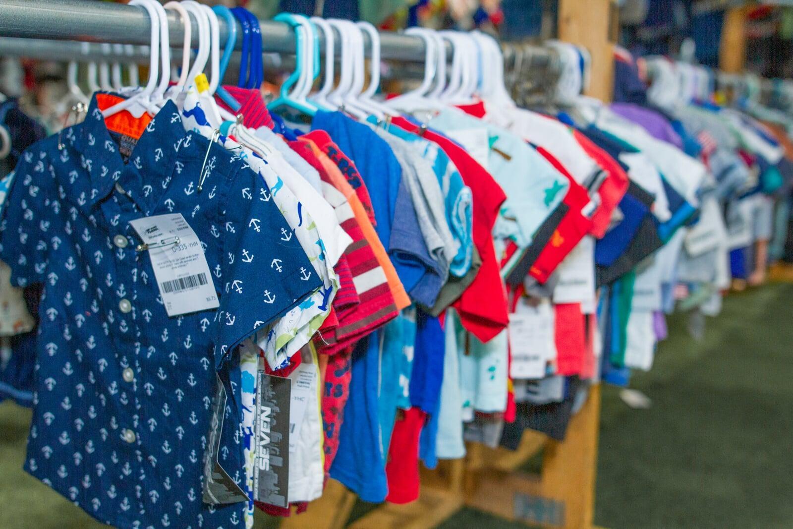 A rack of short sleeve boys shirts.