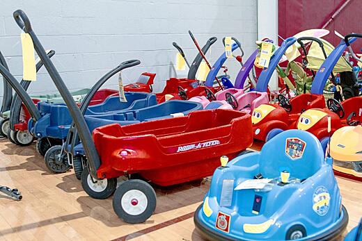 Wagons sitting on a hardwood basketball court