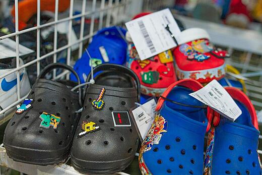 Shelf of Crocs shoes