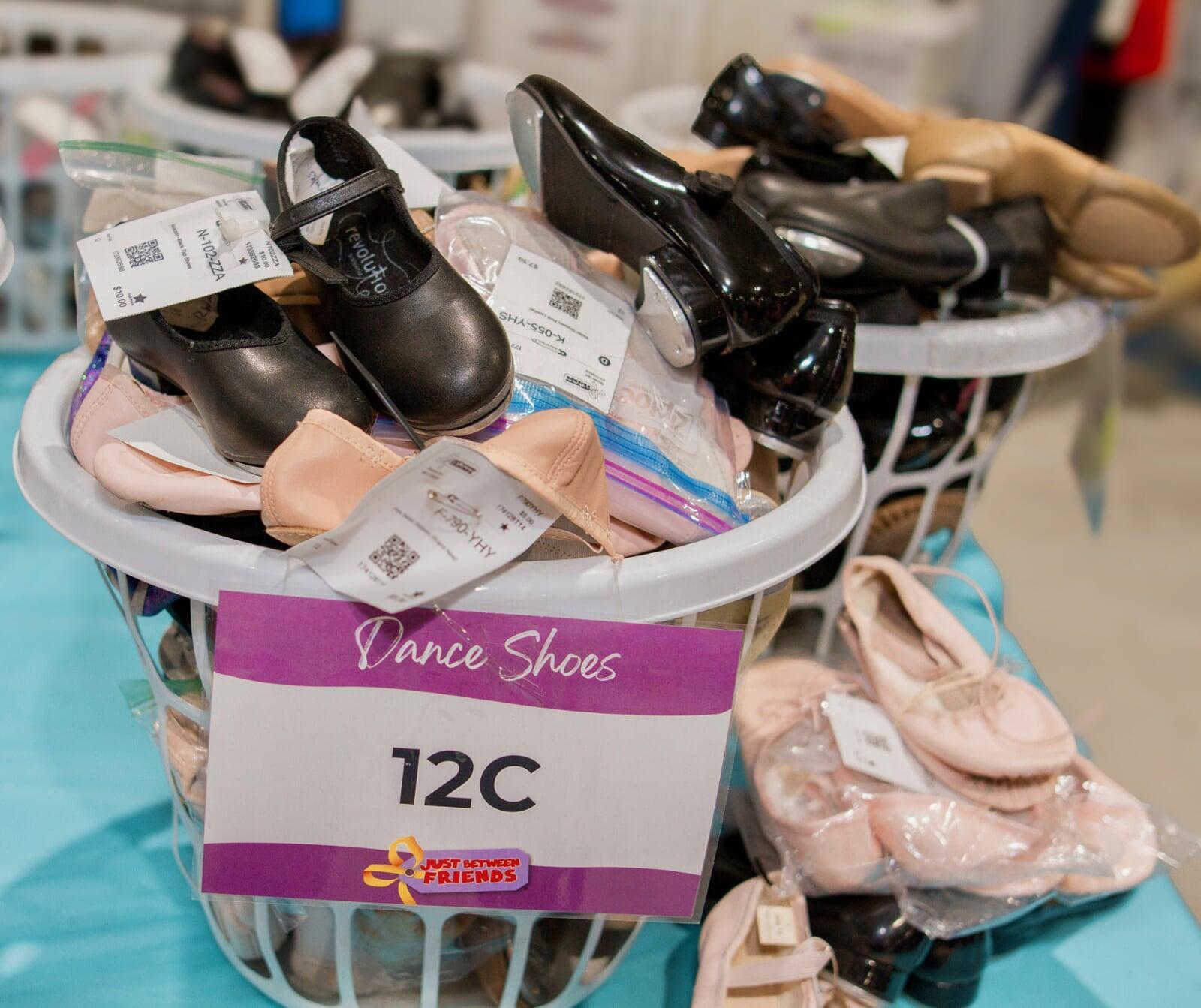 Piles of dance shoes on a table